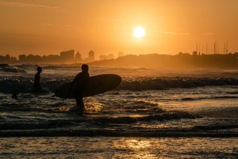 Photo of sunset surfers