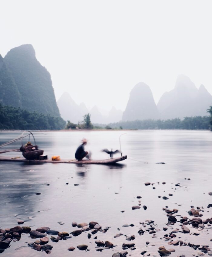 east asia fisherman mountains